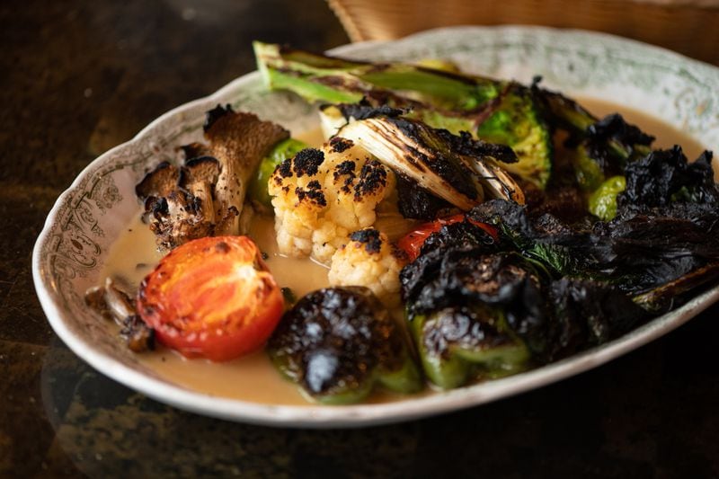 At Nur Kitchen, the charm of the seasonal vegetable platter is not limited to vegetables;  the butter sauce is also memorable.  (Mia Yakel for The Atlanta Journal-Constitution)