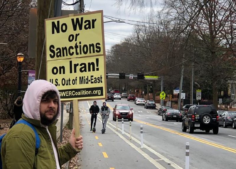 “No War or Sanctions on Iran!” reads a protester’s sign at a rally on Saturday, January 25, 2019, in Atlanta. (Photo: Marlon A. Walker/AJC)