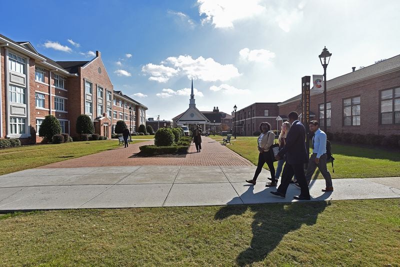 Dr. Henry Tisdale, president of Claflin University, talks with students as they walk to a cafeteria in Claflin University campus in Orangeburg, South Carolina on Thursday, November 30, 2017. Claflin University has a proud and enduring legacy of producing visionary leaders committed to making a difference in a constantly changing global society. (HYOSUB SHIN / HSHIN@AJC.COM)