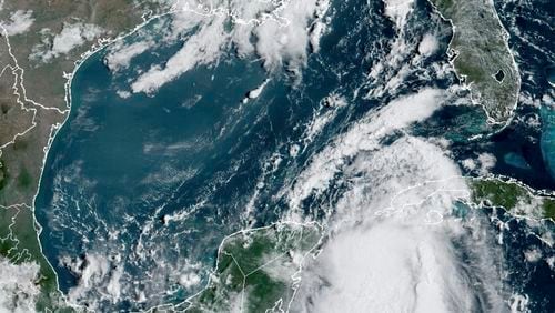 Tropical Storm Idalia gathers strength in the warm waters of the Yucatan Channel between Mexico and Cuba on Monday, Aug. 28, 2023. As Hurricane Idalia charges toward Florida, one factor that could amplify it is the unusually warm water in the Gulf of Mexico — partly the result of the sultry weather that has been smothering the South all summer. (NOAA via via The New York Times) — NO SALES; EDITORIAL USE ONLY —