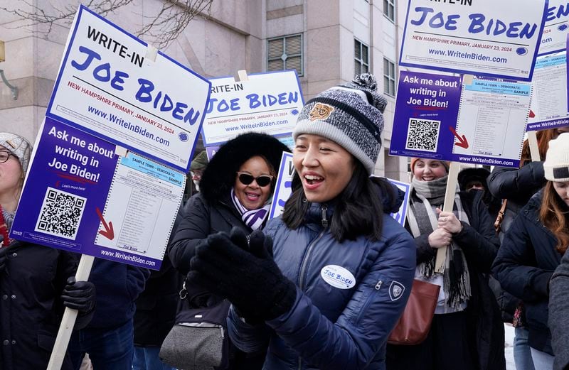 Boston Mayor Michelle Wu joins supporters demonstrating at a Joe Biden Write-In Rally in Manchester, New Hampshire, on Jan. 20, 2024. Biden will not be on New Hampshire's Jan. 23 primary ballot, but supporters are organizing a write-in campaign. (Timothy A. Clary/AFP/Getty Images/TNS)