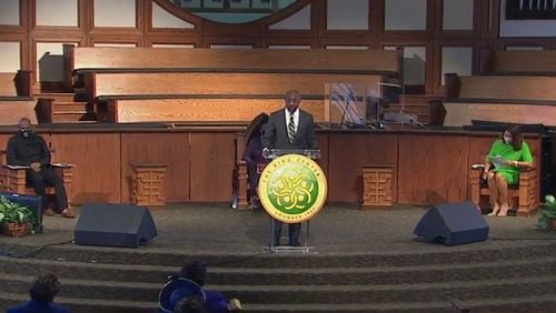 The Rev. Raphael Warnock, senior pastor at Ebenezer Baptist Church and U.S. senator-elect, speaks during the Beloved Community Commemorative Service livestreamed on Monday, January 18, 2021. The holiday event presented by the King Center honors the legacy of the Rev. Martin Luther King Jr. (Photo from King Center livestream)