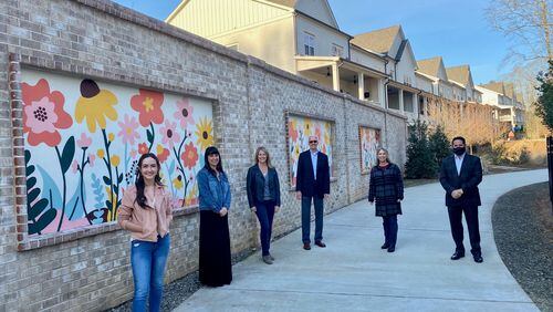 From left, artist Cecilia Gonzalez, Cultural Services Coordinator Meghan Vilela, Cultural Services Manager Kim Zane,  Parks, Recreation and Cultural Services Director Morgan Rodgers, fundraiser Diane Grecco, and City Councilman Donald Mitchell with the new mural  installed  along the AlphaLoop west of the Thompson Street Park and alongside the Midwick neighborhood. (Courtesy City of Alpharetta)