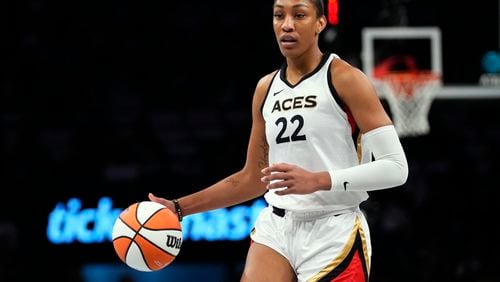 FILE - Las Vegas Aces' A'ja Wilson (22) looks to pass during the first half in Game 3 of a WNBA basketball final playoff series against the New York Liberty Sunday, Oct. 15, 2023, in New York. The Two-time WNBA MVP is getting a Nike signature shoe, in a deal that was announced Saturday, May 11, 2024. (AP Photo/Frank Franklin II, File)
