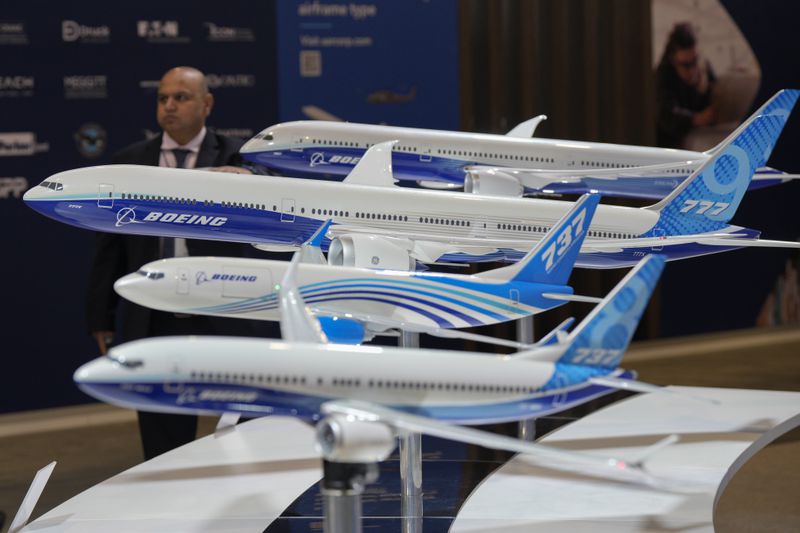FILE - Models of Boeing aircraft are displayed during the Singapore Airshow in Singapore, Feb. 22, 2024. In the latest round of their decades-long battle for dominance in commercial aircraft, Europe's Airbus has established a clear sales lead over Boeing as the American company deals with the fallout from manufacturing troubles and ongoing safety concerns. (AP Photo/Vincent Thian, File)