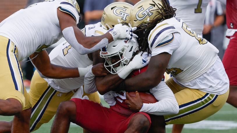 Georgia Tech defenders gang tackle South Carolina State Bulldogs quarterback Corey Fields Jr. for no gain on a keeper during a football game against South Carolina State at Bobby Dodd Stadium in Atlanta on Saturday, September 9, 2023.   (Bob Andres for the Atlanta Journal Constitution)