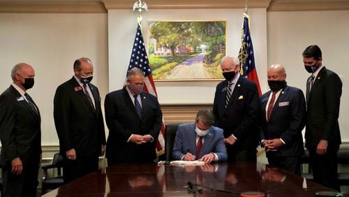 Gov. Brian Kemp signs Georgia's new voting law. Some Georgia companies have faced growing threats of boycotts from voting rights advocates who say local corporations should have done more to oppose the legislation before it was signed.