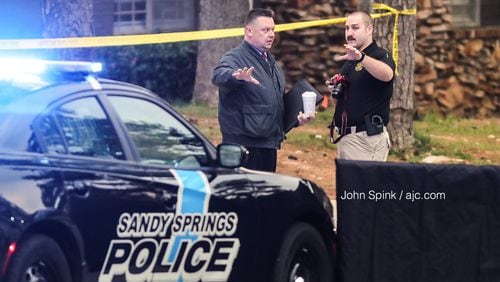 Sandy Springs police officers investigate an officer-involved shooting on Northwood Drive on Thursday morning.