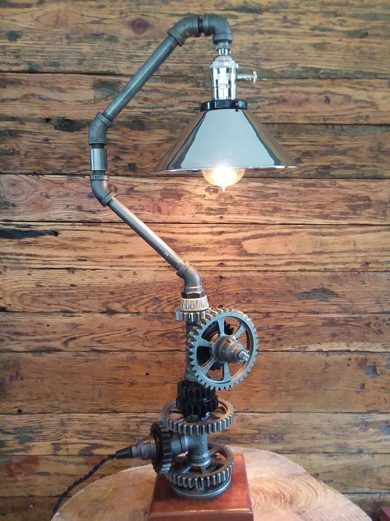 Georgia’s Harry Tallman handcrafts table and floor lamps using materials such as metal gas pipe, exotic woods, automotive parts and salvaged items. Contributed by WoodMetalCreations.com