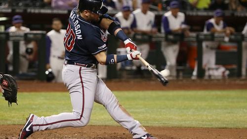 Atlanta Braves' Josh Donaldson connects for a home run against the Arizona Diamondbacks during the ninth inning of a baseball game Thursday, May 9, 2019, in Phoenix. (AP Photo/Ross D. Franklin)