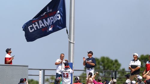 The World Series Champions flag is hoisted in center field at CoolToday Park in North Port, Fla., before the Braves' first exhibition game of the season on March 18. (Curtis Compton / Curtis.Compton@ajc.com)