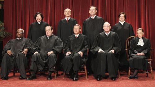 The nine justices of the U.S. Supreme Court. Seated from left: Associate Justices Clarence Thomas and Antonin Scalia, Chief Justice John Roberts, and Associate Justices Anthony M. Kennedy and Ruth Bader Ginsburg. Standing, from left: Associate Justices Sonia Sotomayor, Stephen Breyer, Samuel Alito Jr. and Elena Kagan. (AP Photo/Pablo Martinez Monsivais, File)