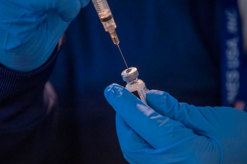 A Pfizer BioNTech COVID-19 vaccine shot is prepared at a DeKalb Board of Health COVID-19 vaccination site located at the Doraville MARTA transit station in Doraville, Monday, March 15, 2021. (Alyssa Pointer / Alyssa.Pointer@ajc.com)