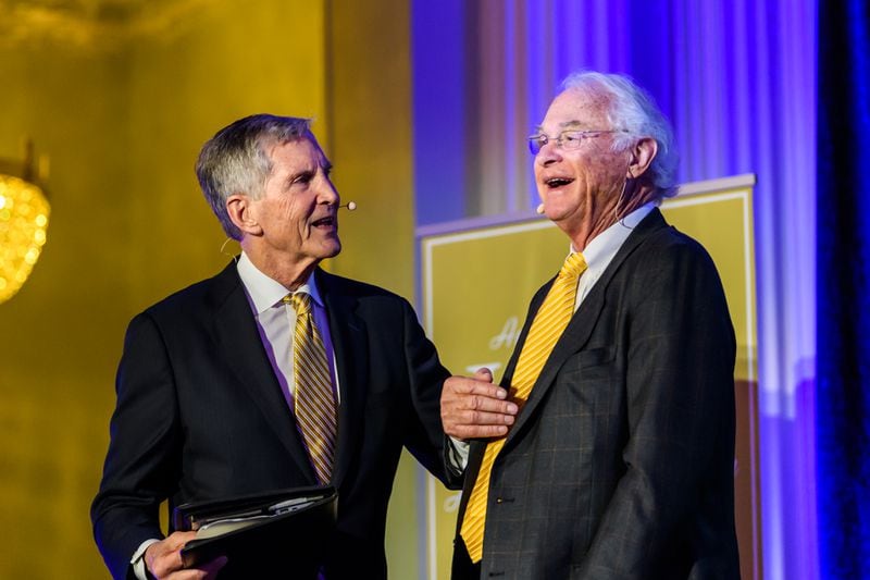 Georgia Tech great Jack Thompson (right), a former Tech assistant football coach and administrator credited with raising nearly $600 million for Tech athletics purposes, reacts to a comment by Bill Curry, a former Tech football player and head coach, at a dinner in 2018 honoring Thompson for his 50 years of service to Tech athletics. Thompson died July 21, 2021. (Photo by Danny Karnik/Georgia Tech Athletics)