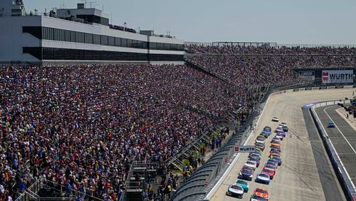 William Byron (24) leads the field into Turn 1 on a restart during a NASCAR Cup Series auto race at Dover Motor Speedway, Sunday, April 28, 2024, in Dover, Del. (AP Photo/Derik Hamilton)