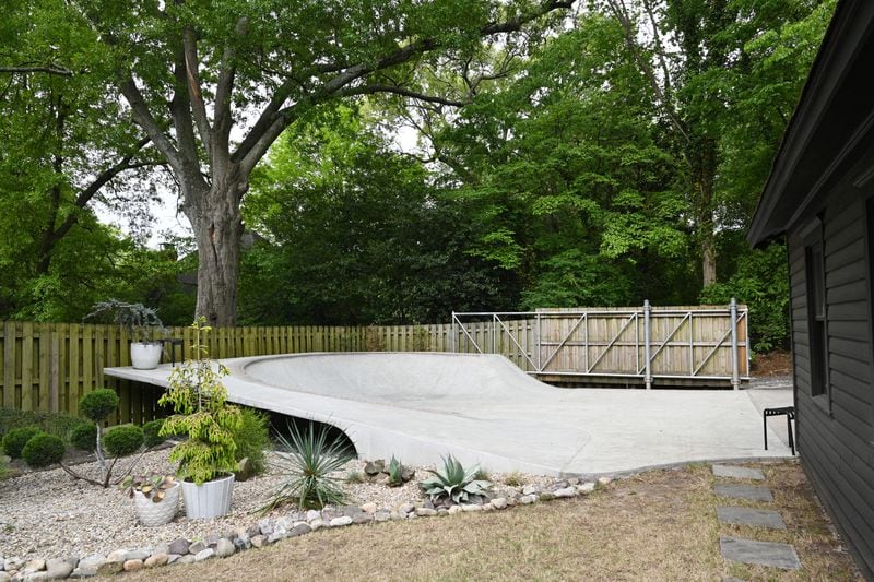 Alison Michaels-Fandel indulged her husband Derek Fandel’s love of skateboarding with a specially designed concrete skate bowl in their Grant Park backyard. When they purchased the home in 2017, the historic property hadn’t been lived in for 26 years, so the backyard was a mess. (Hyosub Shin / Hyosub.Shin@ajc.com)