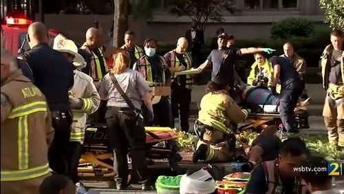 Fifteen people were injured Saturday when a "pedal pub" overturned in Midtown Atlanta, officials said.