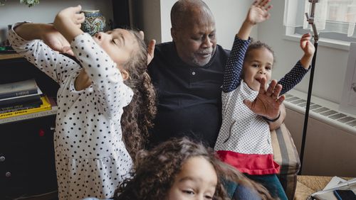 Barry Sage-El, 69, who describes himself as the master of the sleepover, with his three granddaughters at his home in Montclair, N.J. Men have been creating new norms for grandparenting with help from a growing body of resources, including the Atlanta-based podcast, the Cool Grandpa, launched five years ago by Cumming resident Greg Payne.  (Sara Naomi Lewkowicz/The New York Times)