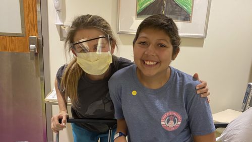 Amelia Ballard, a registered nurse at Children's Healthcare of Atlanta, and a cancer survivor, always knew she wanted to work in pediatric oncology. Here she is with Dani Cuevas, who is 15. (Courtesy of Children’s Healthcare of Atlanta)