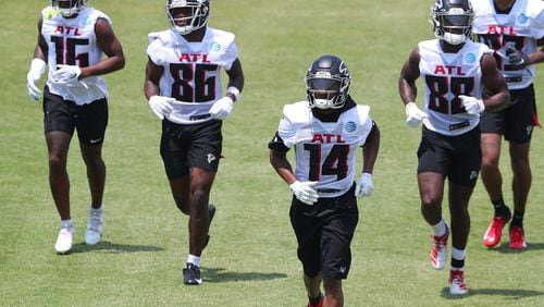 Falcons wide receivers Greg Dortch (from left), Antonio Nunn, Russell Gage and Frank Darby get in some work during organize team activities (OTAs) Tuesday, May 25, 2021, at the team training facility in Flowery Branch. (Curtis Compton / Curtis.Compton@ajc.com)