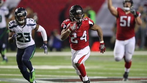 January 14, 2017, Atlanta: Falcons running back Devonta Freeman picks up a long gain against Seahawks Steven Terrell during the second half in a NFL football NFC divisional playoff game on Saturday, Jan. 14, 2017, in Atlanta. Curtis Compton/ccompton@ajc.com