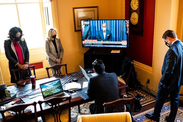 From left: House impeachment managers Delegate Stacey Plaskett (D-Virgin Islands), Rep. Madeleine Dean (D-Pa.), Rep. Joaquin Castro (D-Texas), seated, and Rep. Eric Swalwell (D-Calif.), bow their heads in prayer as Barry Black, the Senate Chaplain, opens the first day of the Senate impeachment trial of former President Donald Trump, at the Capitol in Washington on Tuesday, Feb. 9, 2021. The second impeachment trial of former President Trump is scheduled to began on Tuesday, about a month after he was charged by the House with incitement of insurrection for his role in egging on a violent mob that stormed the Capitol on Jan. 6. (Erin Schaff/The New York Times)