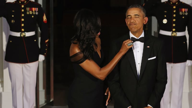 WASHINGTON, DC – SEPTEMBER 25: U.S. First Lady Michelle Obama straightens U.S. President Barack Obama’s tie while they wait on the North Portico for the arrival of Chinese President Xi Jinping and his wife Madame Peng Liyuan ahead of a state dinner at the White House September 25, 2015, in Washington, DC. Obama and Xi announced an agreement on curbing climate change and an understanding on cyber security. (Photo by Chip Somodevilla/Getty Images)