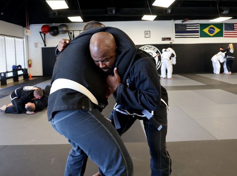 10/19/2021 -Marietta, Georgia: Officer Kenyon Jackson trains at Borges Brazilian Jiu Jitsu gym in an effort to reduce use-of-force injuries. The Marietta police department now mandates weekly training sessions. (Tyson Horne / Tyson.Horne@ajc.com)
