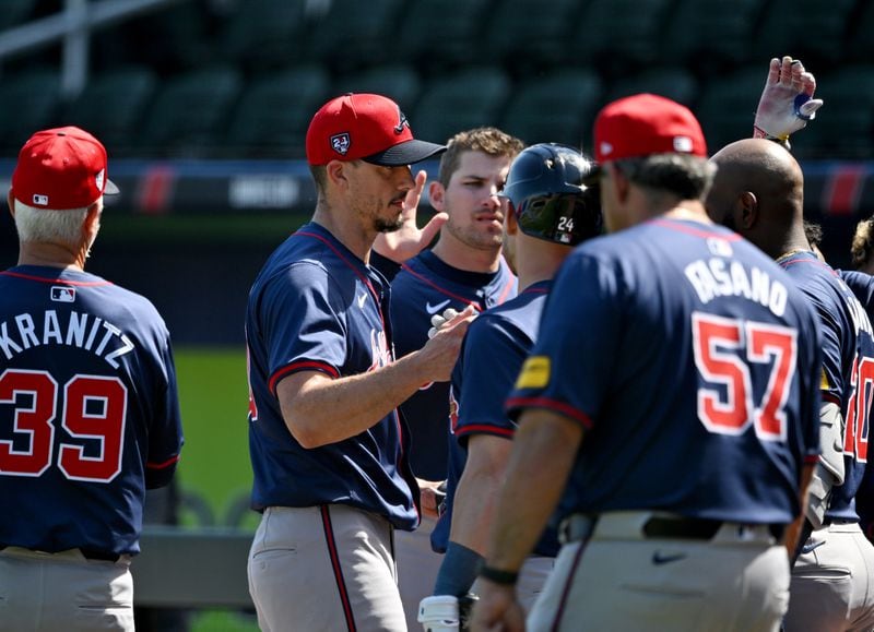 Atlanta Braves starting pitcher Charlie Morton is greeted by teammates after live pitching during spring training workouts at CoolToday Park, Friday, Feb. 23, 2024, in North Port, Florida. (Hyosub Shin / Hyosub.Shin@ajc.com)