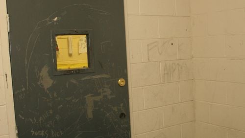 This metal door locked Jonathan King into a seclusion room at one of Georgia's "psychoeducational" programs for students with behavioral and emotional disabilities. Jonathan hanged himself in this room in 2004. (Photo by Gainesville Police Department.)