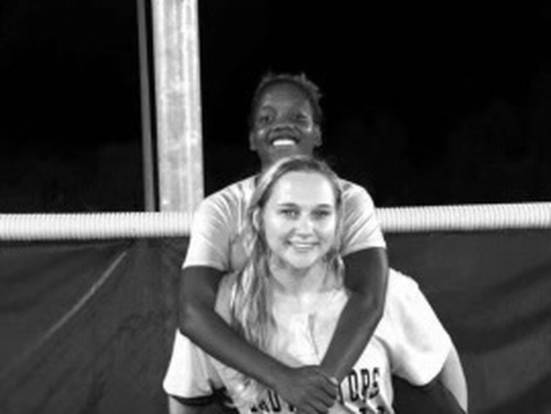 Emily Middleton carrying close friend and Ware County High Gator softball teammate Kennedy Sanders.