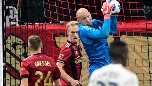 Atlanta United goalkeeper Brad Guzan makes a save during the second half of an MLS soccer game against the New England Revolution, Saturday, Oct. 6, 2018. (John Amis)