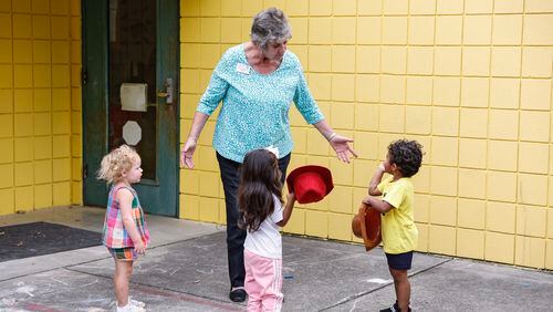 Mary Thelma Norris, director of Friendship House Daycare in Dalton, Ga. plays with students on the playground. (Natrice Miller/ Natrice.miller@ajc.com)