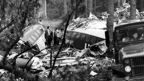 Investigators stand amid the ruins of Southern Flight 242 on April 10, 1977.