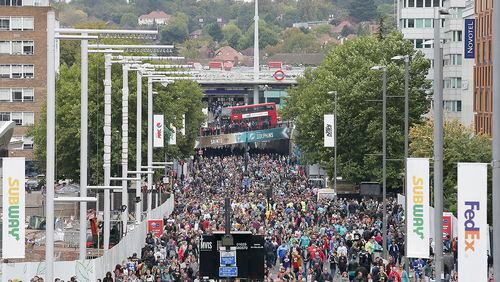 Spectators walk up Wembley Way as they arrive for an NFL football game between the Miami Dolphins and the New Orleans Saints at Wembley Stadium in London, Sunday Oct. 1, 2017. (AP Photo/Tim Ireland)