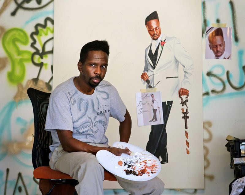 Artist Fahamu Pecou is shown in front of his painting, “…Most of all No Signifyin’.” “Do or Die,” an exhibition of his work, is on view at Emory University. 