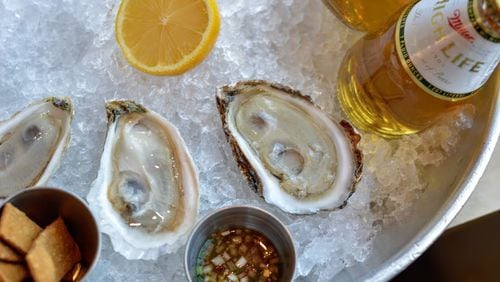 Oysters and beer are $1 during the week at One Eared Stag. Photo credit: Green Olive Media.