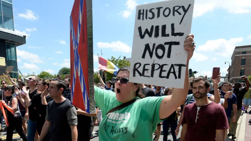Artist Hattie Pink marches with her anti-Confederate artwork in reaction to a potential white supremacists rally on Friday in Durham, North Carolina. The demonstration comes a week after a fatal clash during a "Unite the Right" rally between white supremacists and counter protesters in Charlottesville, Virginia.