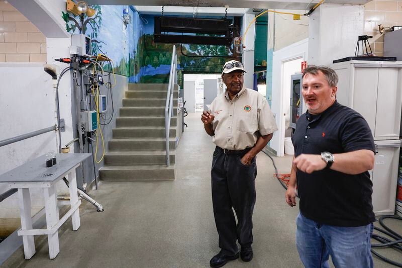 (Left to right) Summerville Mayor Harry Harvey and Water Treatment Plant Superintendent Jason Greene stand inside the plant’s filter gallery on Wednesday, October 4, 2023. 