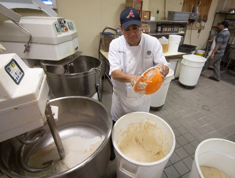 Head baker Cristobal Miranda makes Country Italian bread at the Buckhead Bread Company in Atlanta, July 6, 2020 .STEVE SCHAEFER FOR THE ATLANTA JOURNAL-CONSTITUTION