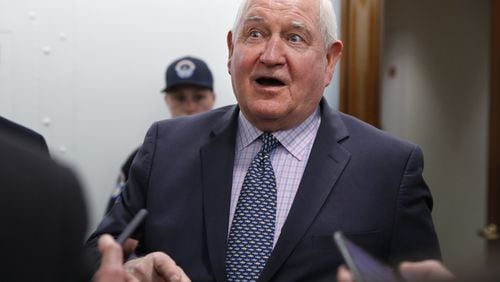 In this April 11, 2018, file photo, Agriculture Secretary Sonny Perdue speaks with reporters on Capitol Hill in Washington. The Trump administration is setting out to accomplish what this year’s farm bill didn’t: Tighten work requirements for millions of Americans who receive federal food assistance. (AP Photo/Jacquelyn Martin, File)