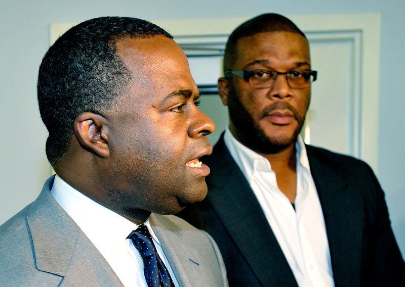 Former Atlanta Mayor Kasim Reed and filmmaker Tyler Perry during a meeting of the McPherson Implementing Local Redevelopment Authority.