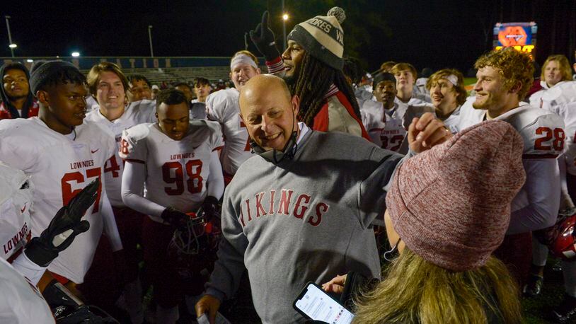 Lowndes head coach Jamey DuBose (center) is all smiles after beating North Cobb 21-13 Friday, December 4, 2020 in Kennesaw. (PHOTO/Daniel Varnado)