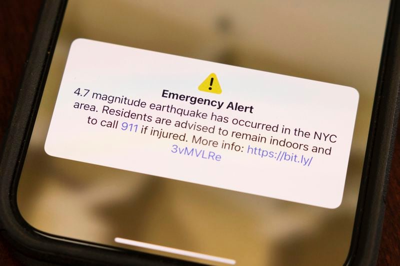 A screen shows an emergency alert in New York City area, Friday, April. 5, 2024, in New York. An earthquake shook the densely populated New York City metropolitan area Friday morning, the U.S. Geological Survey said, with residents across the Northeast reporting rumbling in a region where people are unaccustomed to feeling the ground move. (AP Photo/Yuki Iwamura)