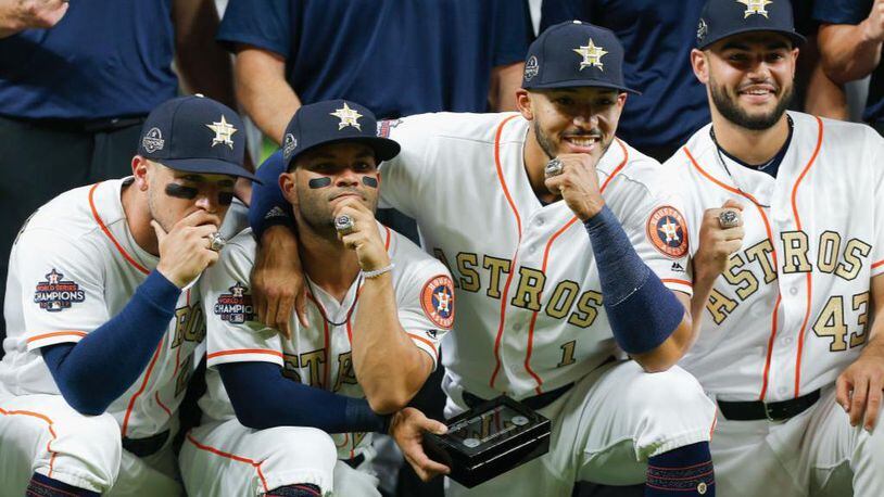 From left, Alex Bregman, Jose Altuve, Carlos Correa and Lance McCullers Jr. show off their World Series rings.