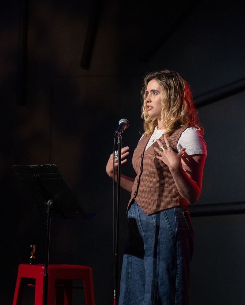Delaney Tarr tells her story on the subject of Rotten at Write Club, a monthly storytelling competition held at Dad's Garage on Wednesday, April 10, 2024.  Contestants, known as Combatants, are given a theme and seven minutes to present, after which the crowd votes with applause. Jenni Girtman for The Atlanta Journal-Constitution)