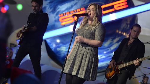 LAKE BUENA VISTA, FL - NOVEMBER 10: Grammy award-winning singer-songwriter Kelly Clarkson performs Nov. 10, 2016 while taping for one of three ABC and Disney Channel holiday TV specials, "The Wonderful World of Disney: Magical Holiday Celebration," "Disney Parks Presents: A Descendants Magical Holiday Celebration," and "The Disney Parks Magical Christmas Celebration" in Epcot at Walt Disney World Resort in Lake Buena Vista, Fla. The Thanksgiving and Christmas telecasts air nationwide on November 24, and December 25 on ABC-TV, and the Descendants holiday telecast airs November 25 on Disney Channel. (Photo by Mark Ashman/Disney Parks via Getty Images)