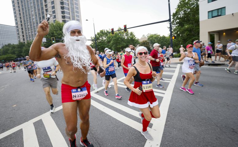 Runners in costume at the 53rd running of the Atlanta Journal-Constitution Peachtree Road Race in Atlanta on Sunday, July 3, 2022. (Miguel Martinez / Miguel.Martinezjimenez@ajc.com)