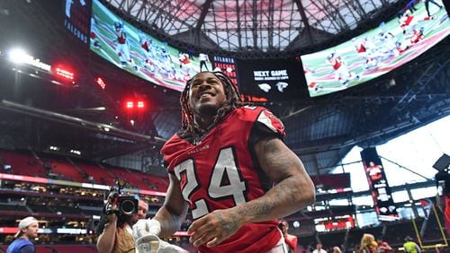 December 8, 2019 Atlanta - Atlanta Falcons running back Devonta Freeman (24) leaves with a smile after Atlanta Falcons beat Carolina Panthers during the second half in a NFL football game at Mercedes-Benz Stadium on Sunday, December 8, 2019. Atlanta Falcons won 40-20 over the Carolina Panthers. (Hyosub Shin / Hyosub.Shin@ajc.com)