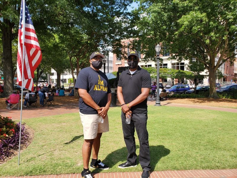 Friends James Ford and Willie Robinson attend the Cobb NAACP Juneteenth observance Friday June 19, 2020 at Marietta Square. KRISTAL DIXON / AJC